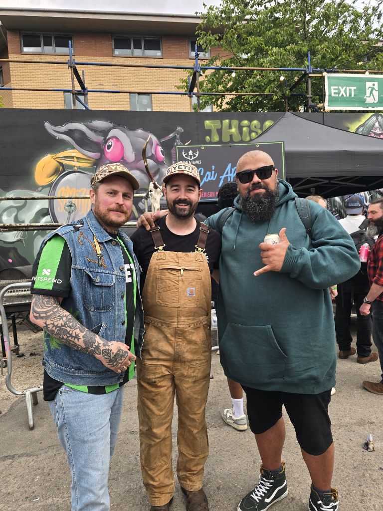 Cai with friends at a festival with Game and Flames stand