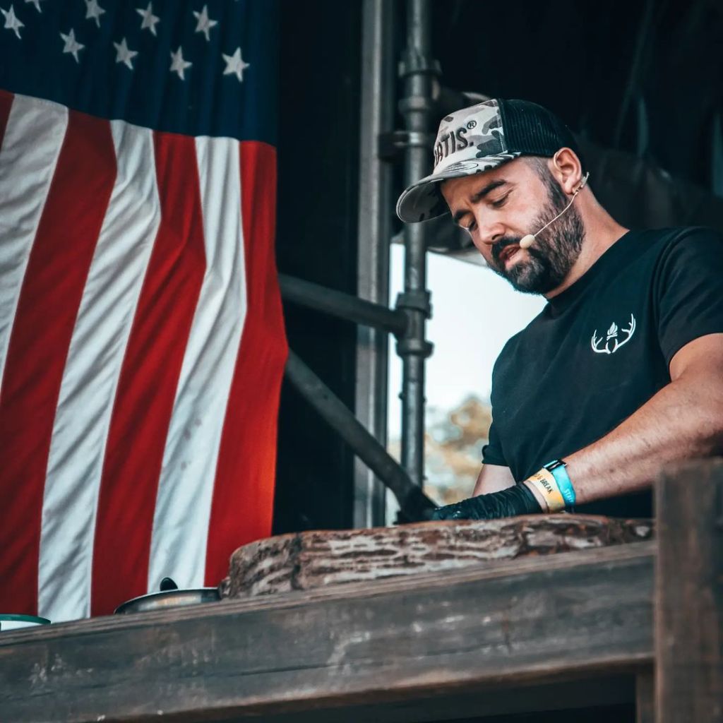Cai Ap Bryn cooking in the USA with American flag
