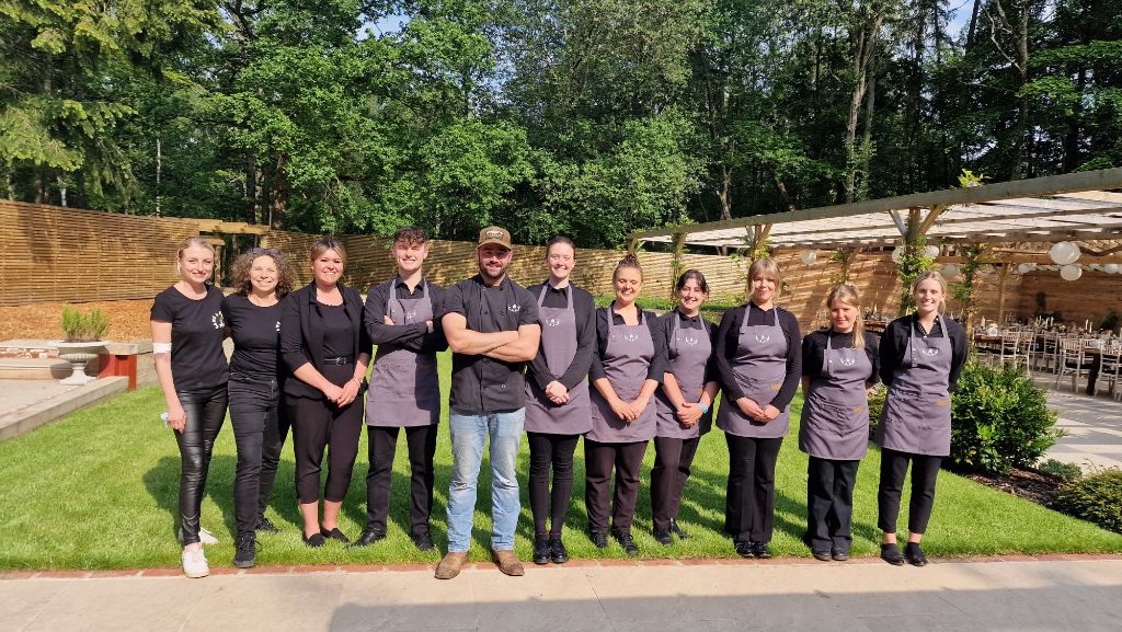 Full Game and Flames service team lined up at a wedding venue