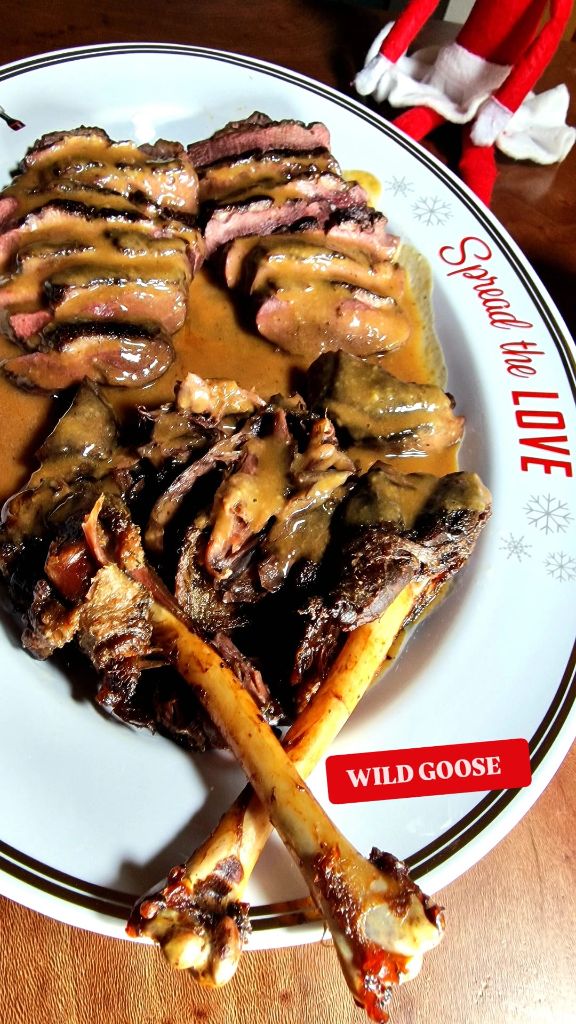 Wild goose Christmas platter with sliced breast, gravy and festive elf