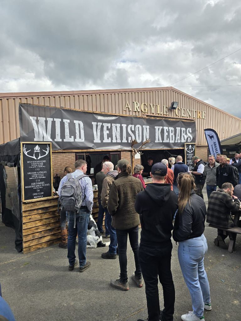 Wild Venison Kebabs stand front view with queuing crowd
