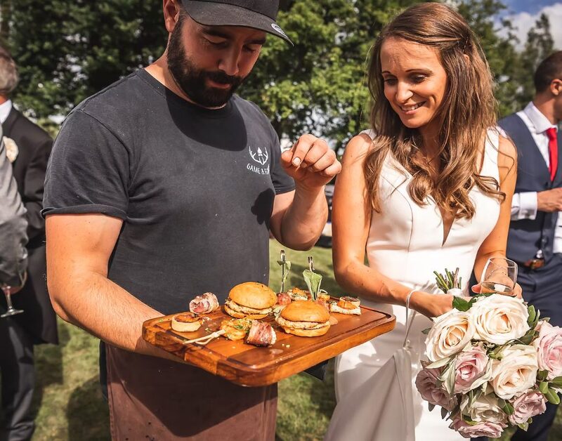 Cai serving canapes to bride