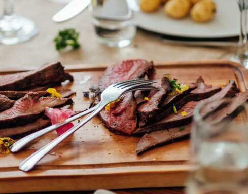 Plated fire-cooked butternut squash with butter