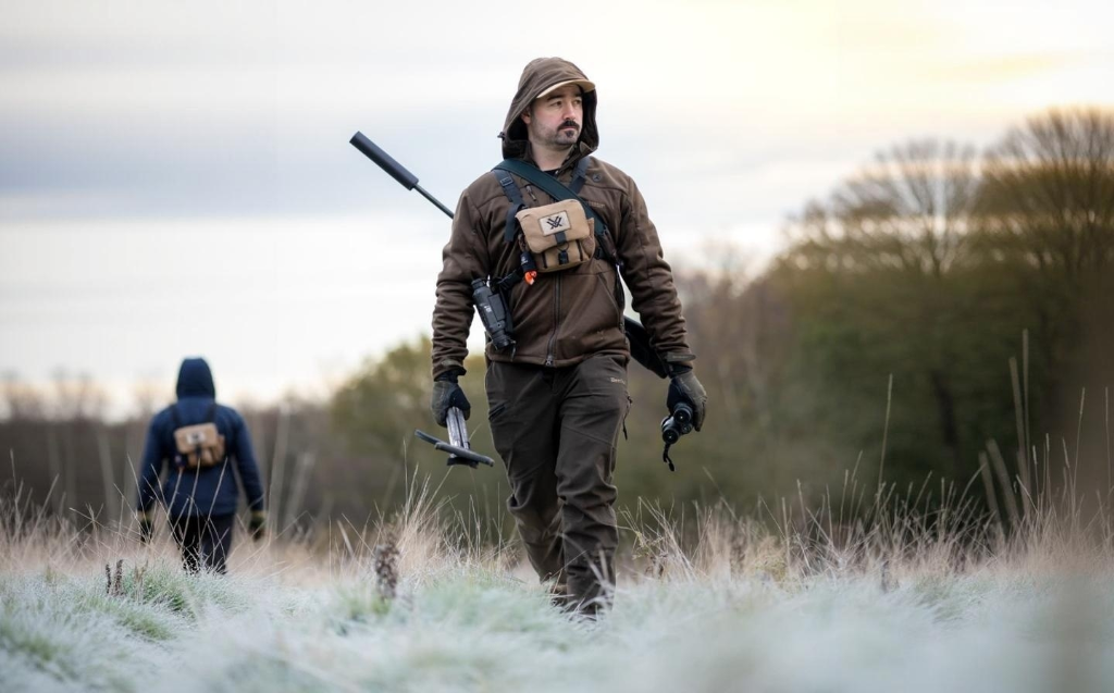 Cai Ap Bryn stalking through frosty fields at dawn with rifle and Vortex chest rig
