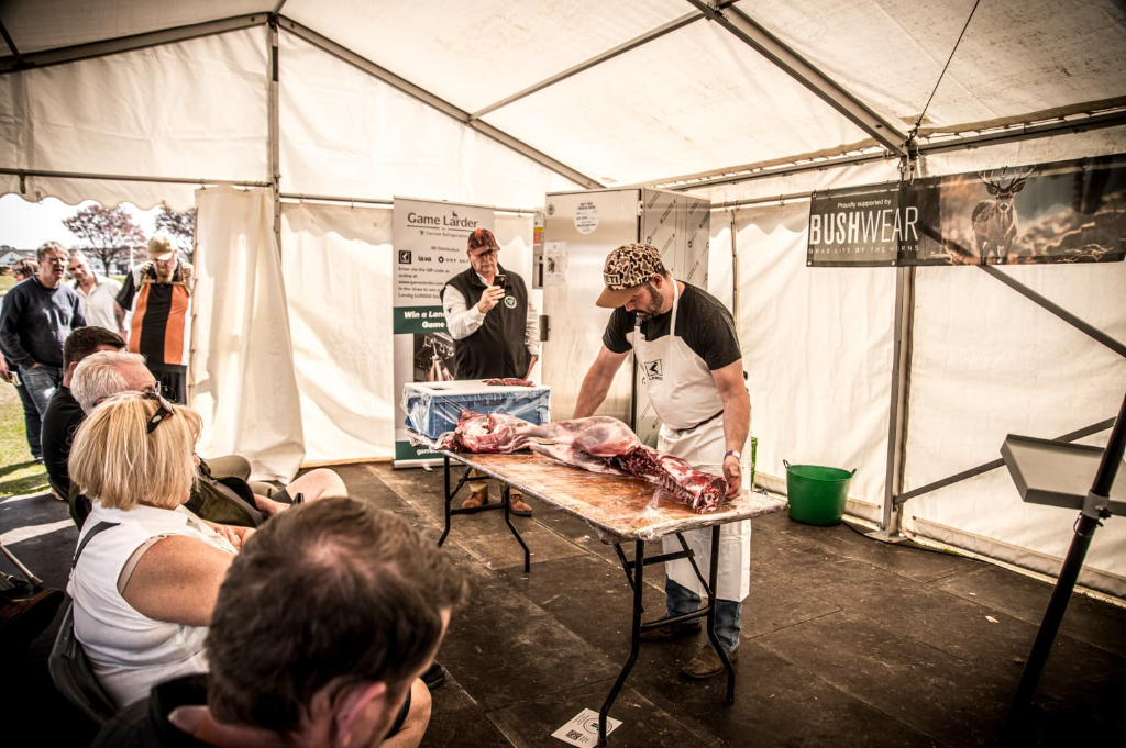 Cai Ap Bryn leading a live butchery demonstration at a workshop event